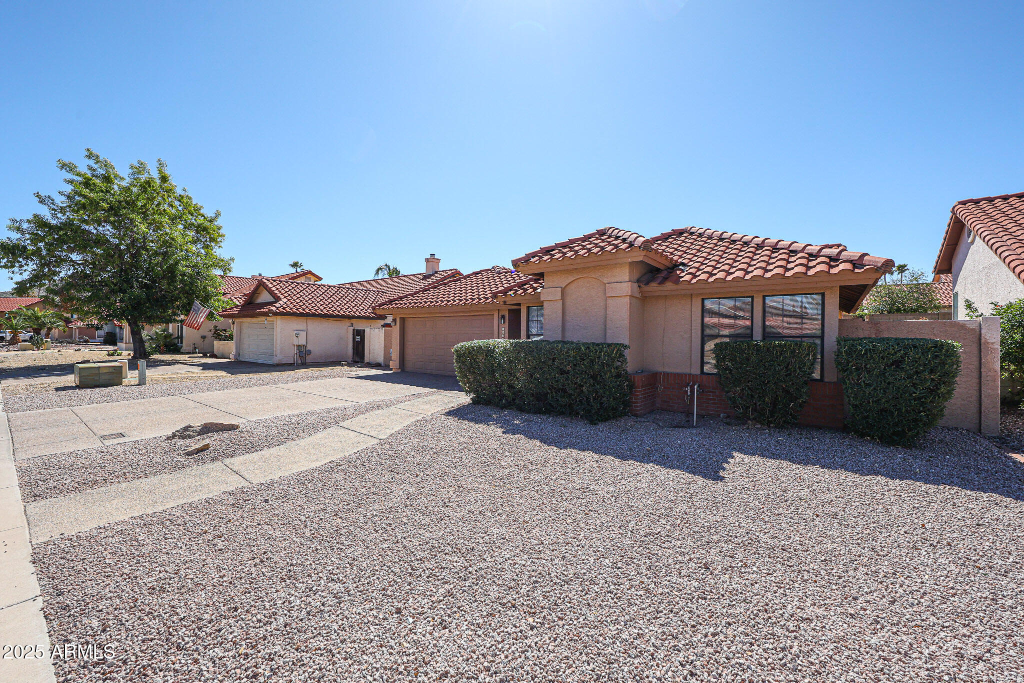 1833 East Redfield Road Phoenix, AZ 85022 - Photo 39 of 41 a front view of a house with a yard and garage