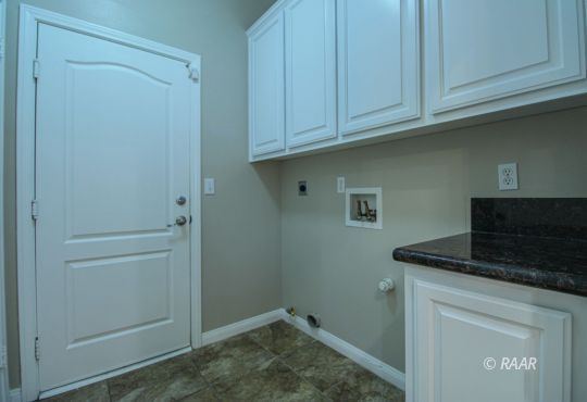 428 Abigail Street Ridgecrest, CA 93555 - Photo 13 of 34 a kitchen with white cabinets and a sink
