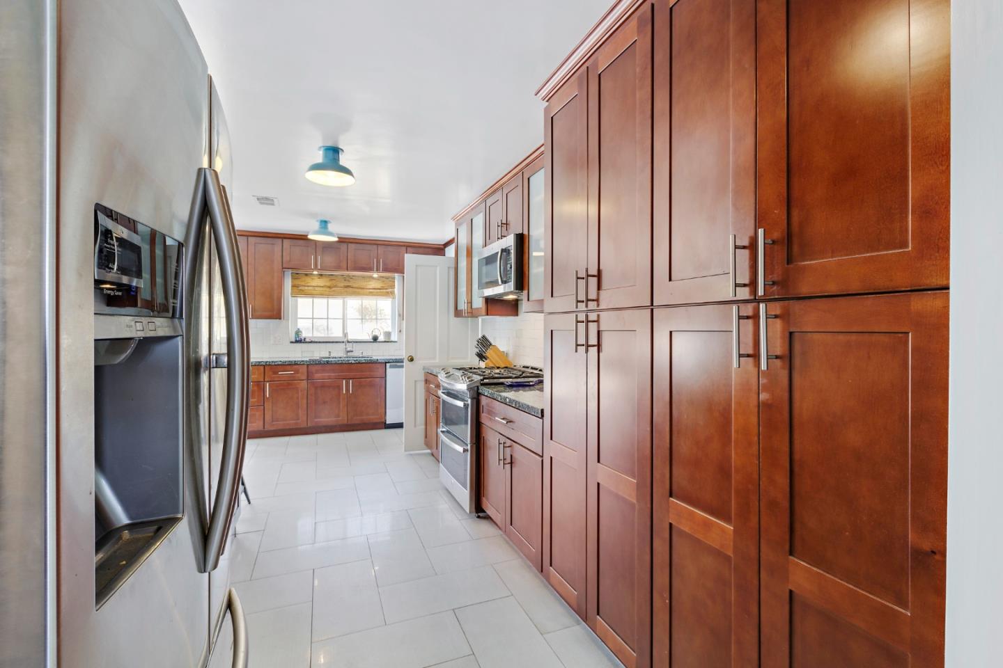 4853 Proctor Road Castro Valley, CA 94546 - Photo 13 of 43 a kitchen with stainless steel appliances granite countertop a refrigerator and a stove