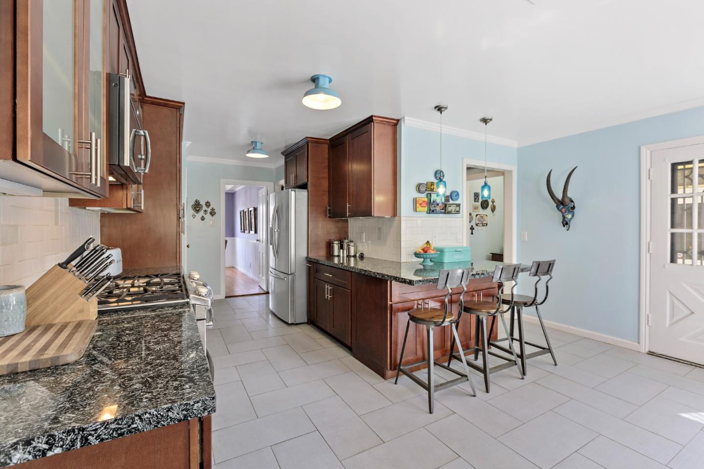 4853 Proctor Road Castro Valley, CA 94546 - Photo 16 of 43 a large kitchen with a table and chairs