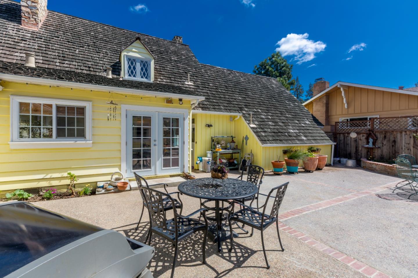 4853 Proctor Road Castro Valley, CA 94546 - Photo 19 of 43 a patio with a table and chairs and potted plants