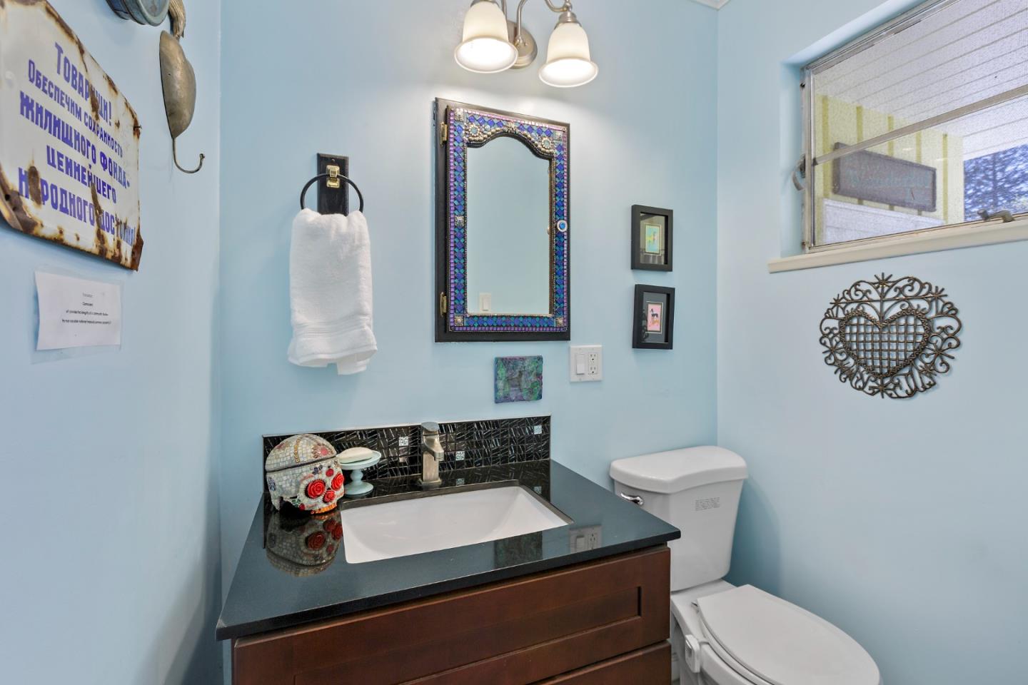4853 Proctor Road Castro Valley, CA 94546 - Photo 23 of 43 a bathroom with a toilet sink and mirror