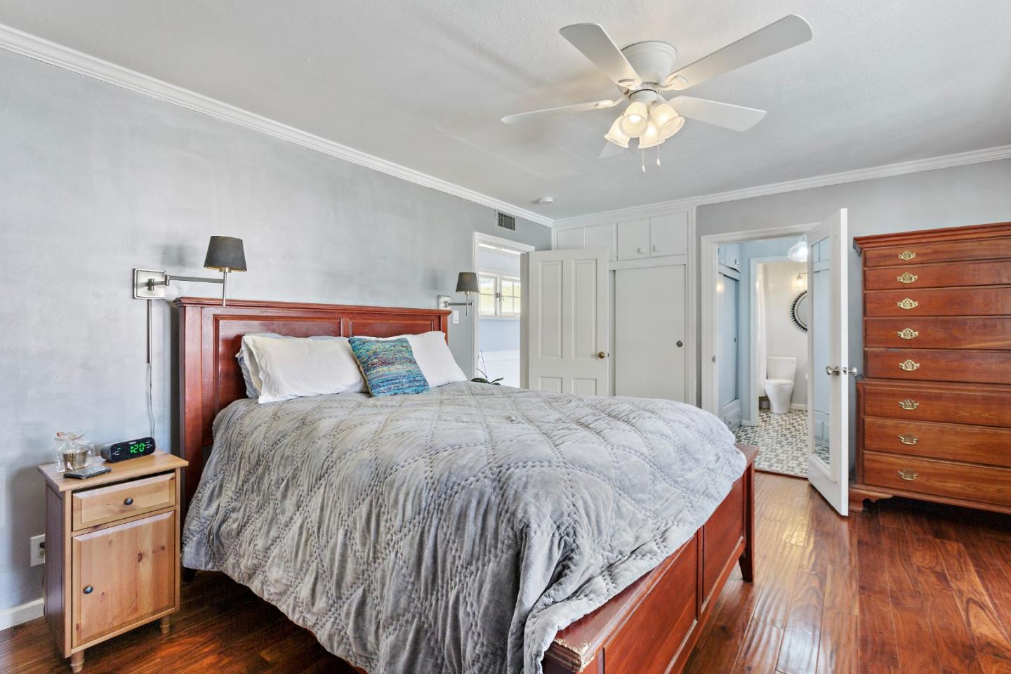 4853 Proctor Road Castro Valley, CA 94546 - Photo 27 of 43 a bed room with a bed and a ceiling fan