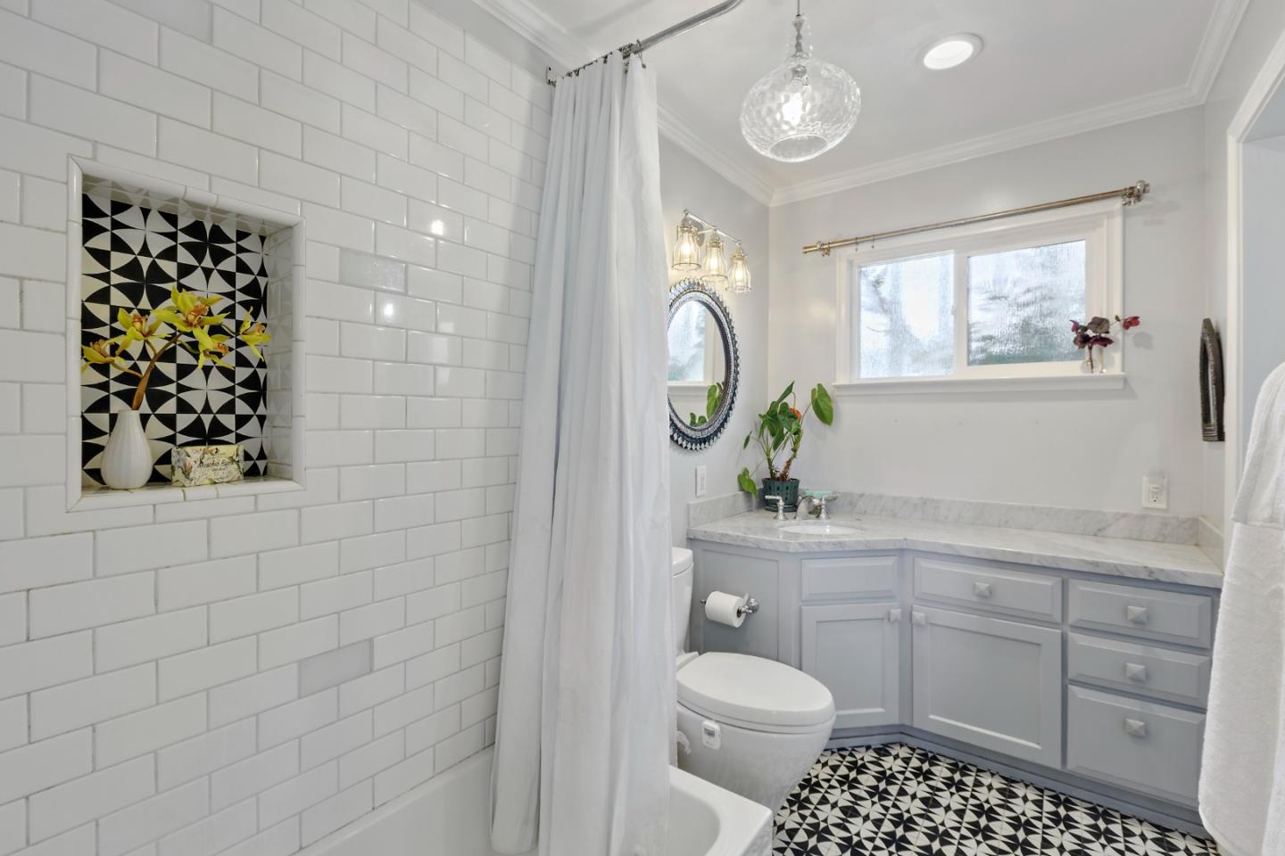 4853 Proctor Road Castro Valley, CA 94546 - Photo 30 of 43 a bathroom with a toilet a sink and a mirror