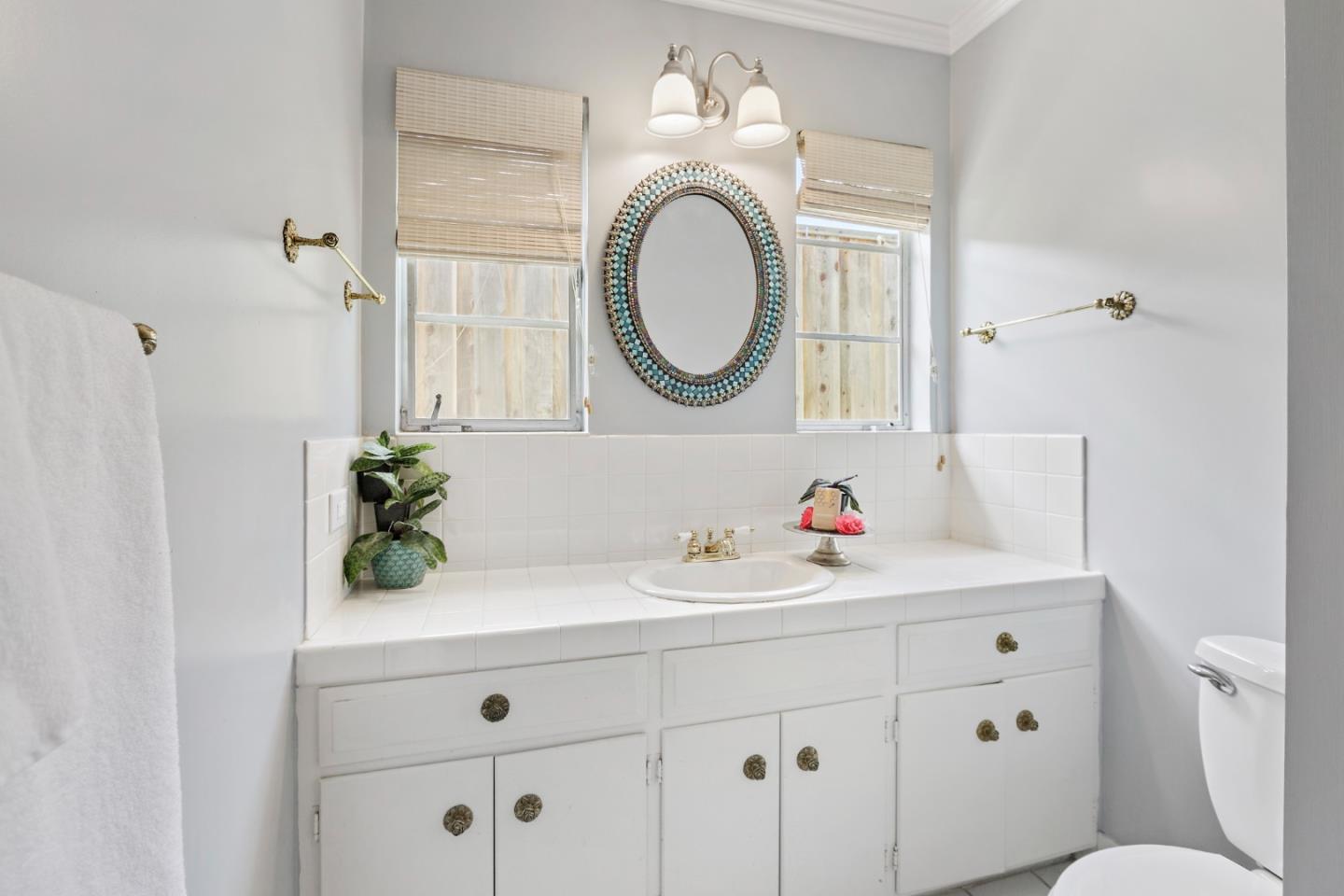 4853 Proctor Road Castro Valley, CA 94546 - Photo 32 of 43 a bathroom with a sink and a mirror