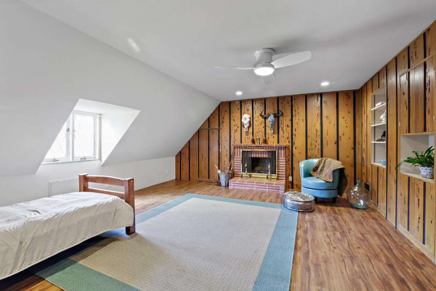 4853 Proctor Road Castro Valley, CA 94546 - Photo 39 of 43 a bedroom with furniture a chandelier and wooden floor