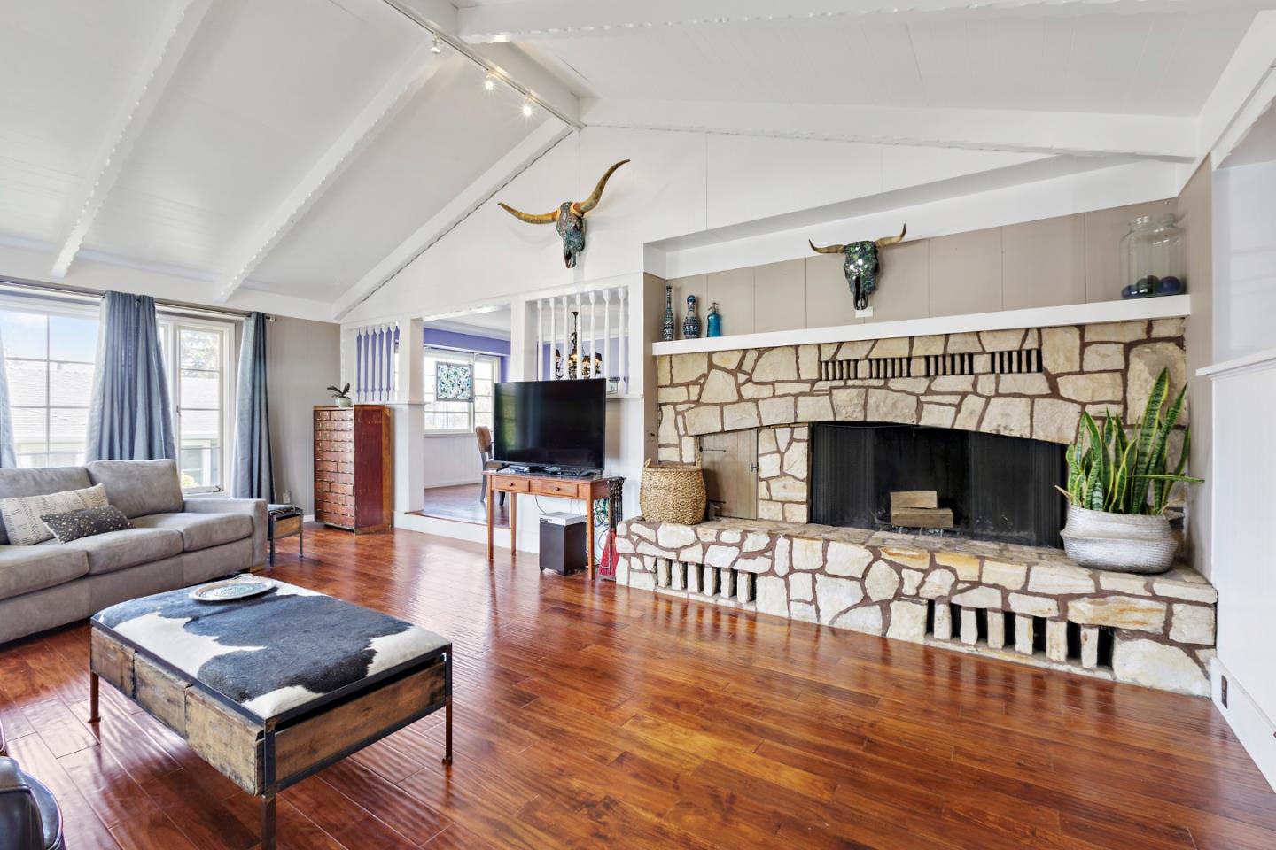 4853 Proctor Road Castro Valley, CA 94546 - Photo 5 of 43 a living room with furniture a flat screen tv and a fireplace