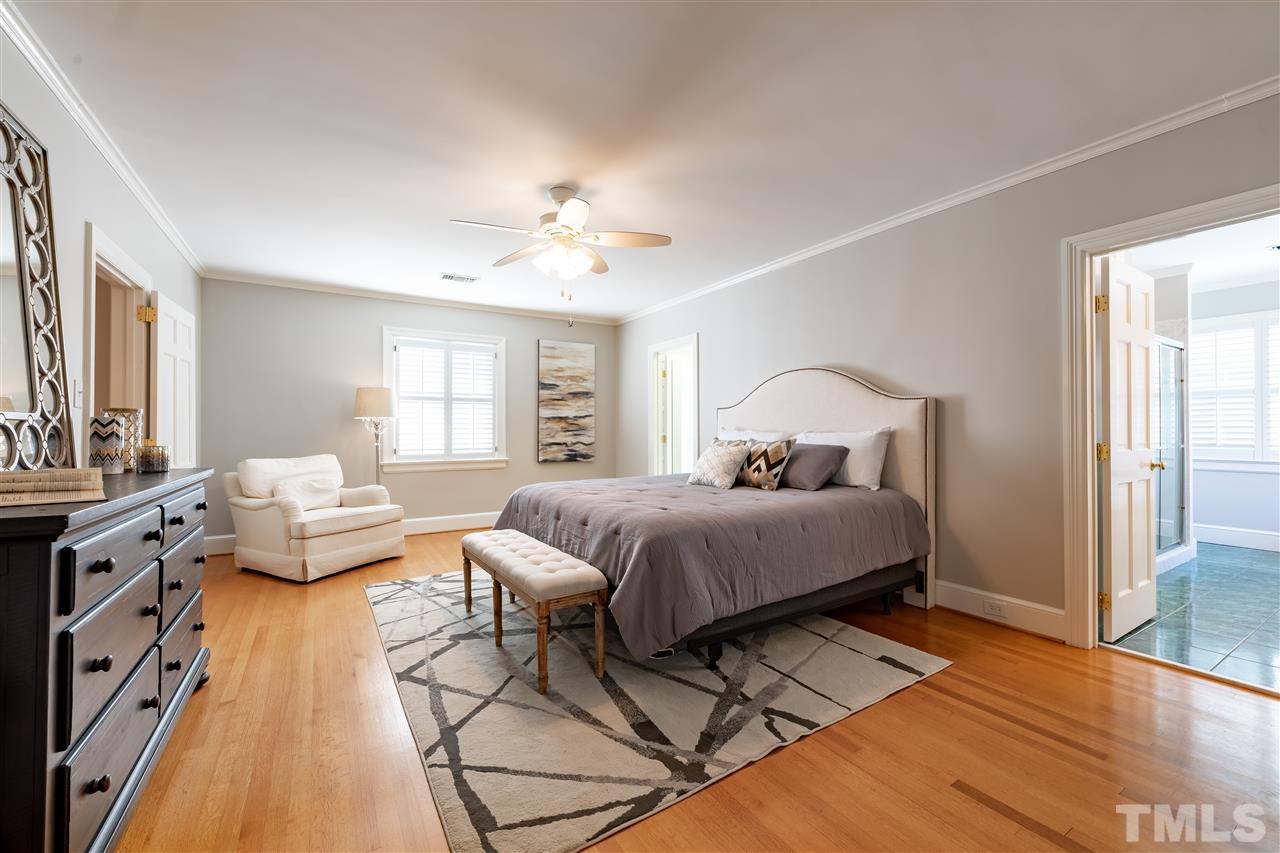 1110 Harvey Street Raleigh, NC 27608 - Photo 11 of 30 Master bedroom has a large walk-in closet and luxurious master bathroom with large shower and separate tub.
