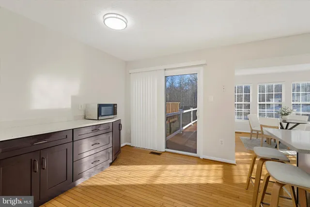 a kitchen with stainless steel appliances kitchen island granite countertop a sink and counter space
