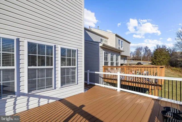 a view of a balcony with wooden floor