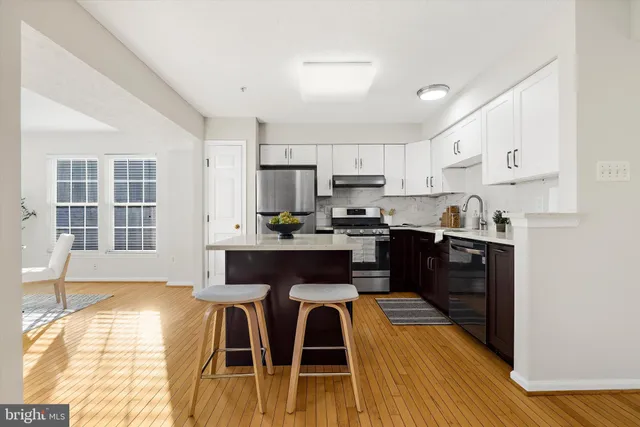 a bathroom with a toilet a sink and a mirror