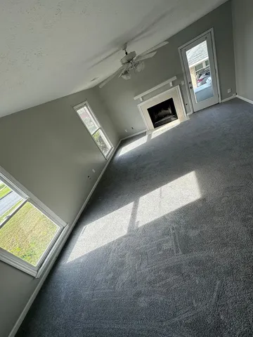 a view of an empty room and window