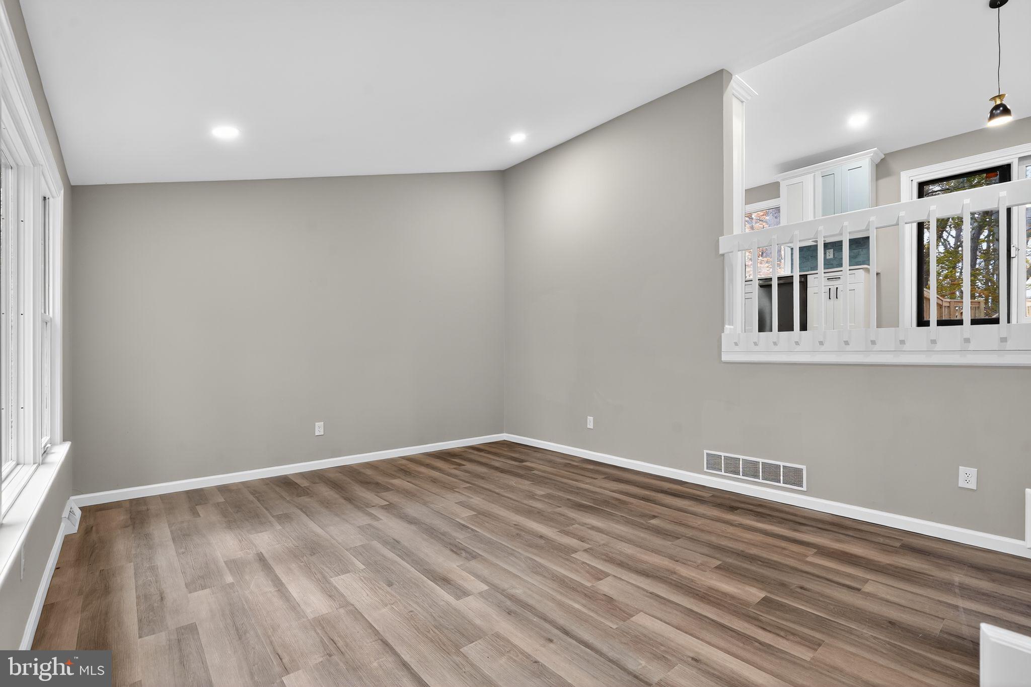 120 Gilbert Road Bordentown, NJ 08505 - Photo 15 of 52 an empty room with wooden floor and windows