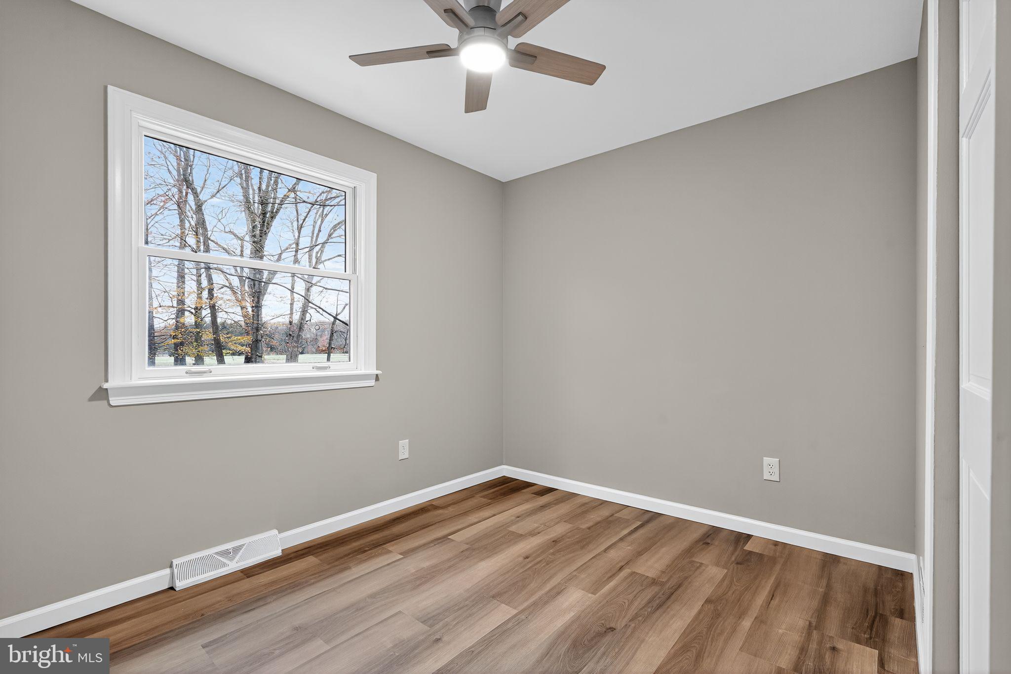 120 Gilbert Road Bordentown, NJ 08505 - Photo 31 of 52 a view of an empty room with wooden floor and a window
