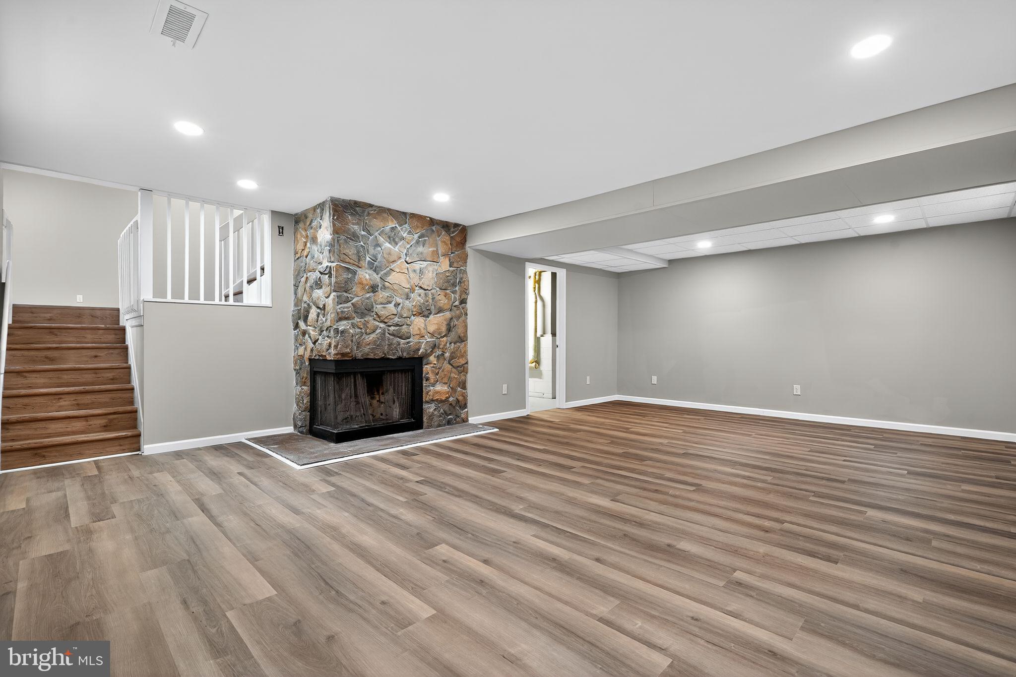 120 Gilbert Road Bordentown, NJ 08505 - Photo 37 of 52 a view of an empty room with wooden floor fireplace and a window