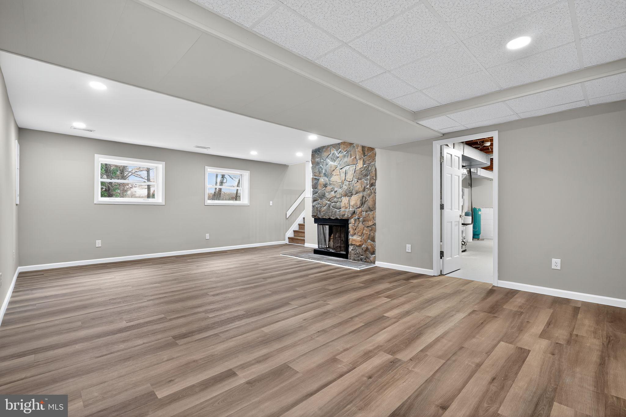 120 Gilbert Road Bordentown, NJ 08505 - Photo 40 of 52 a view of empty room with wooden floor and fireplace
