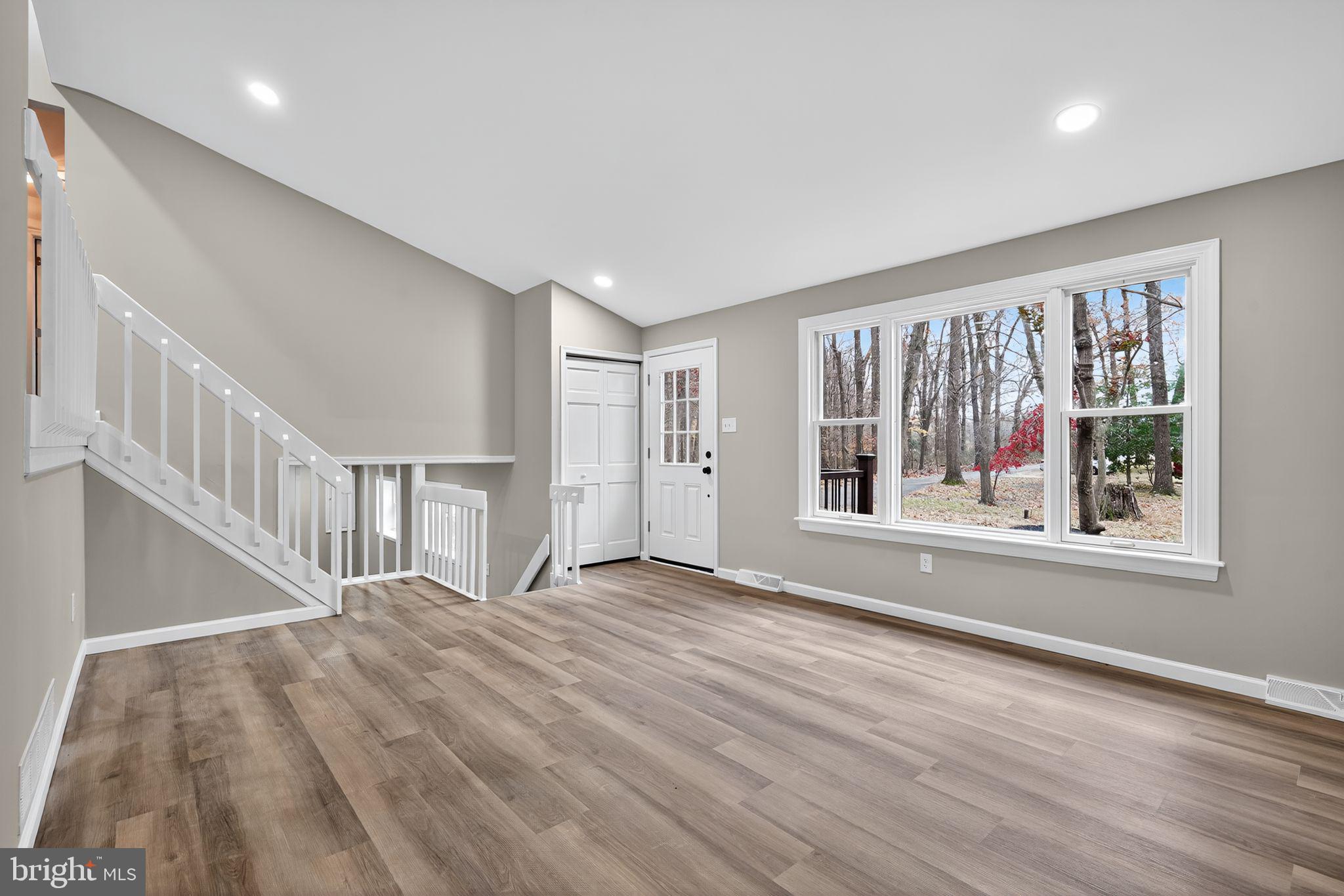 120 Gilbert Road Bordentown, NJ 08505 - Photo 10 of 52 a view of an empty room with wooden floor and a window