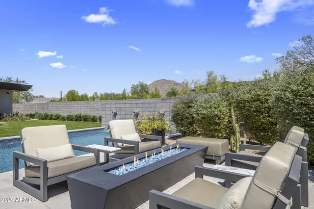 a view of a patio with couches and a table and chairs