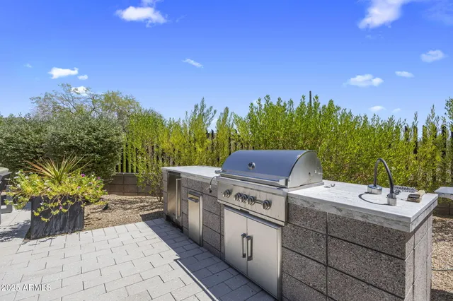a view of a kitchen with a stove and a chair
