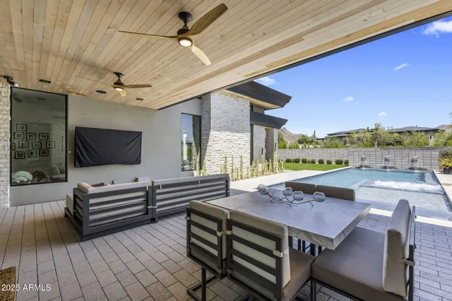 a view of a patio with swimming pool