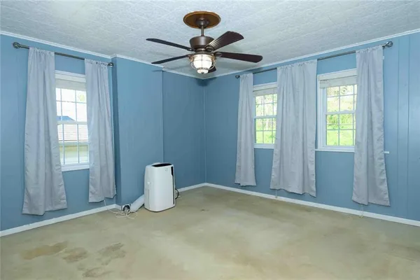 a view of livingroom with window and ceiling fan