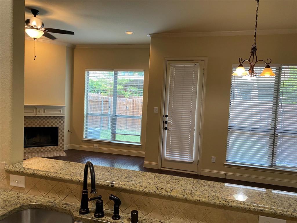 2222 Kirby Street Dallas, TX 75204 - Photo 18 of 25 Kitchen peninsula with a granite countertop, undermount sink, and dark bronze faucet