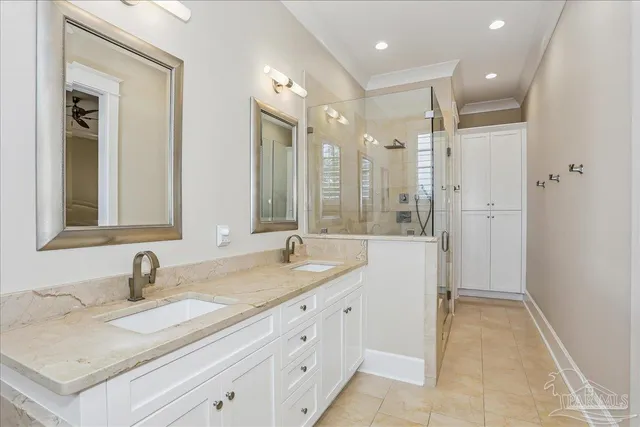 a bathroom with a granite countertop sink mirror and double