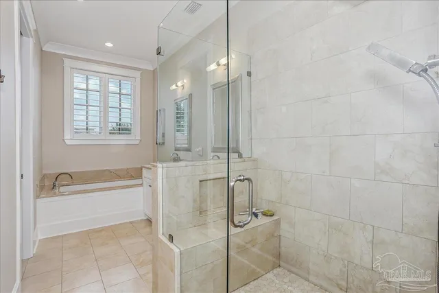 a bathroom with a bathtub and a shower