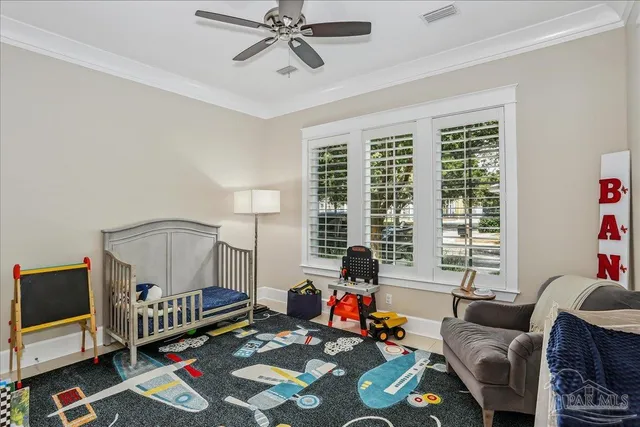 a living room with furniture a flat screen tv and a window