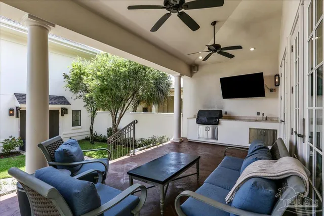 a living room with furniture and a flat screen tv