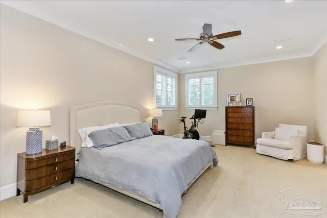 a bedroom with bed and window