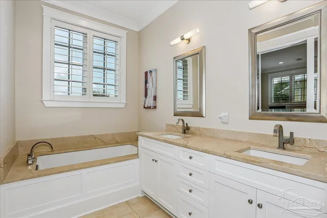 a bathroom with sink bathtub and window