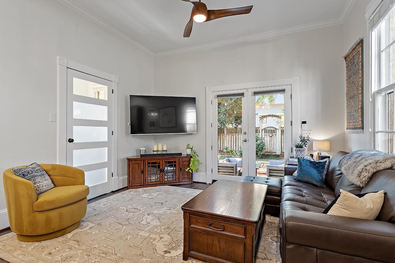 424 East Jones Street Raleigh, NC 27601 - Photo 13 of 27 a living room with furniture and a flat screen tv