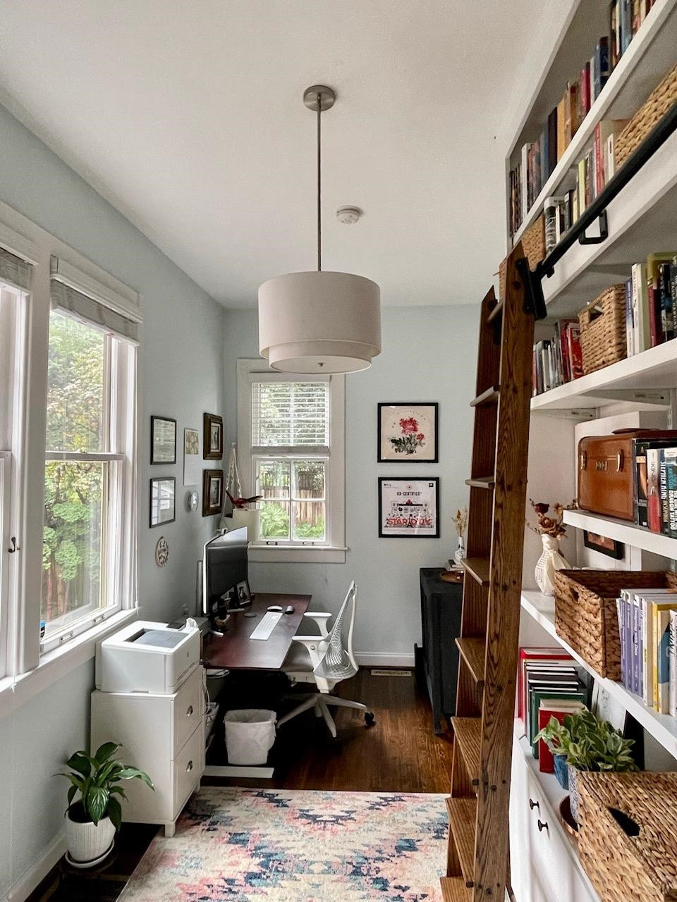 424 East Jones Street Raleigh, NC 27601 - Photo 18 of 27 a living room with furniture a window and a bookshelf