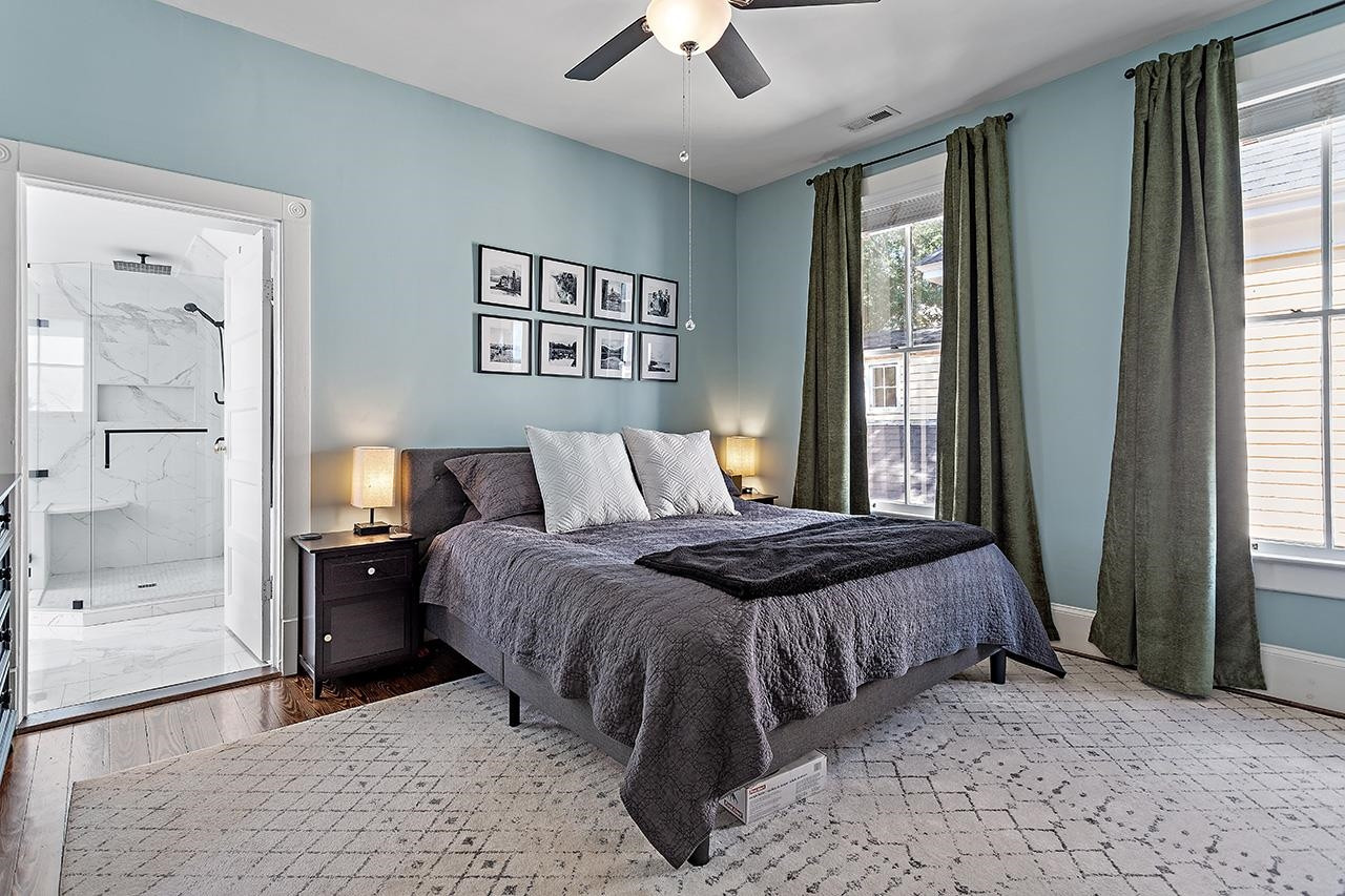 424 East Jones Street Raleigh, NC 27601 - Photo 20 of 27 a bedroom with a bed and a window