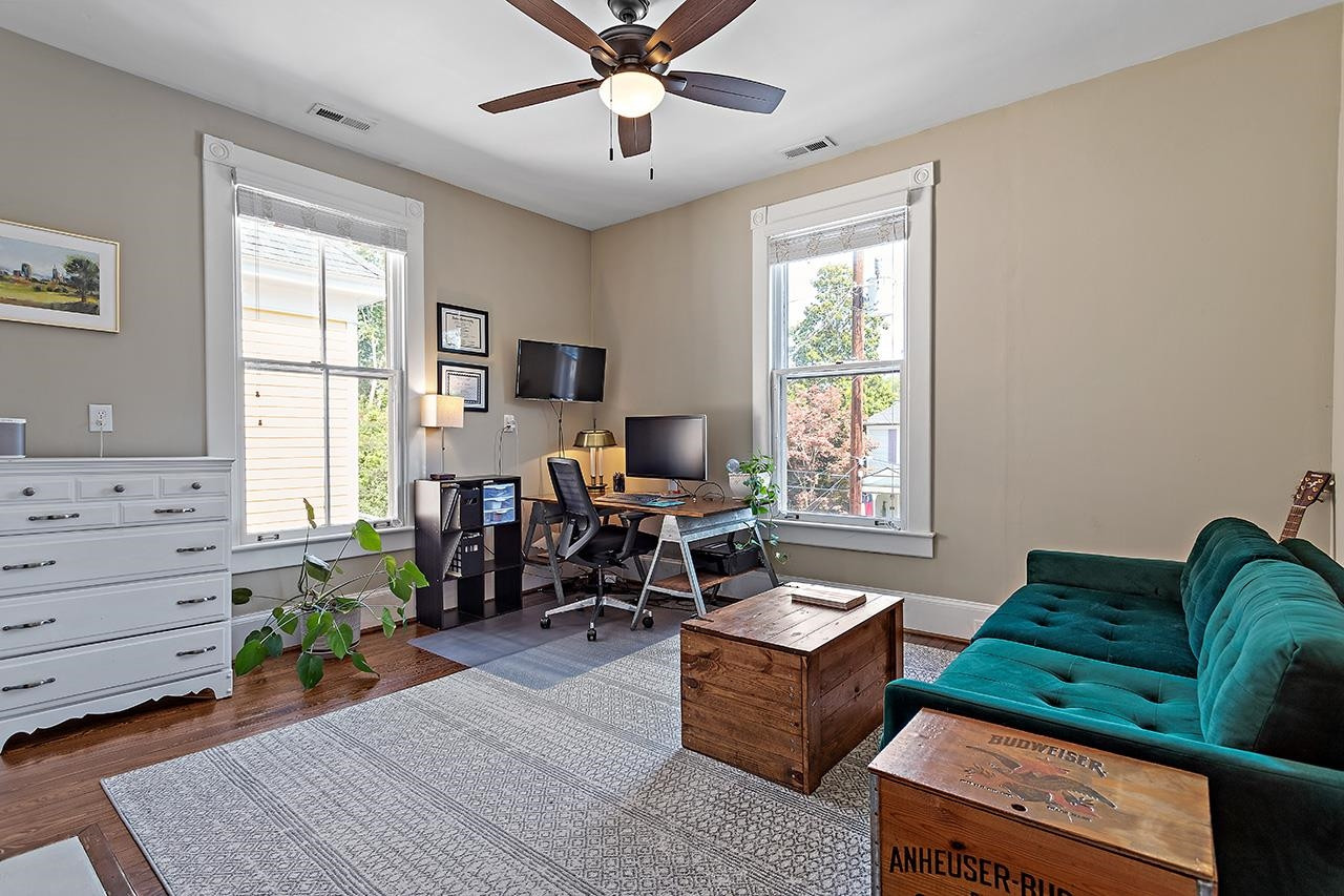 424 East Jones Street Raleigh, NC 27601 - Photo 21 of 27 a living room with furniture and a window