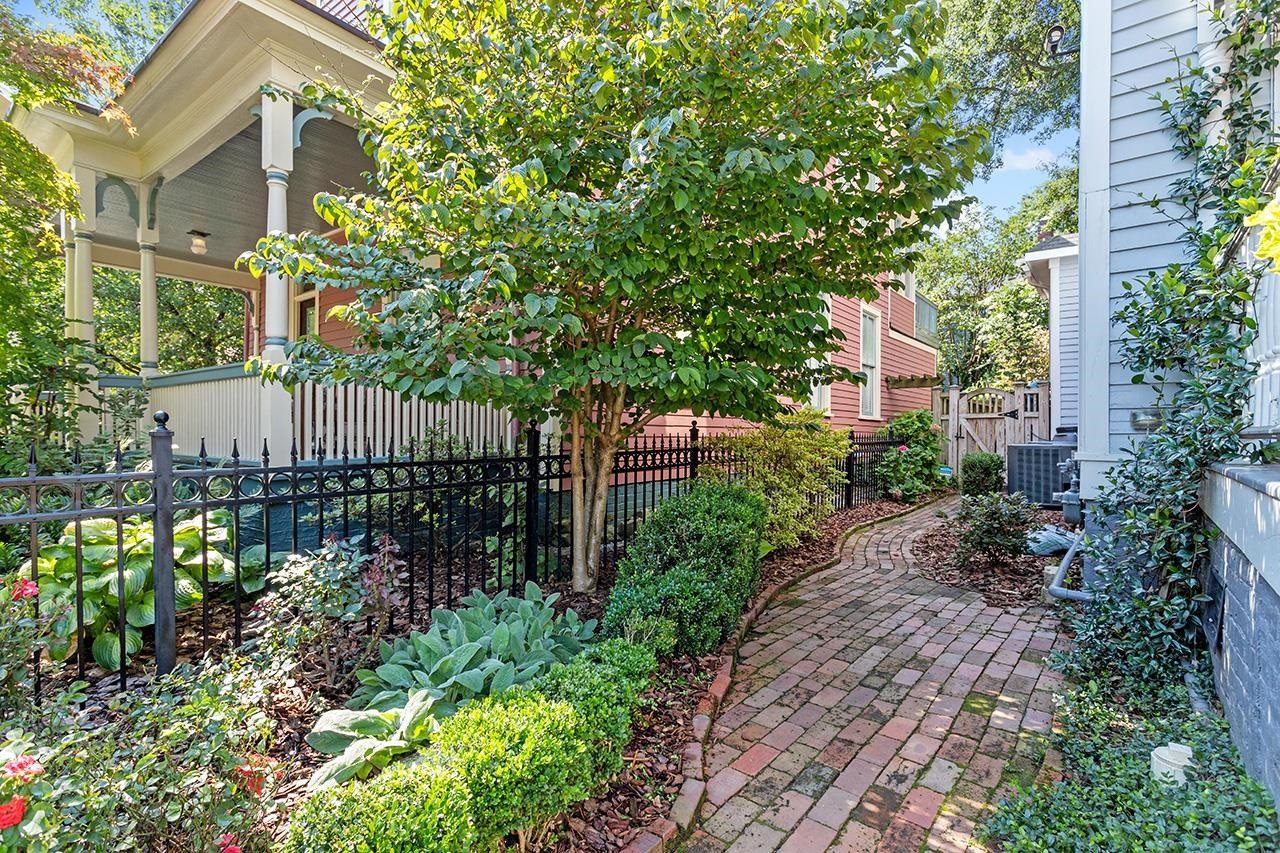 424 East Jones Street Raleigh, NC 27601 - Photo 24 of 27 a view of a garden with wooden fence