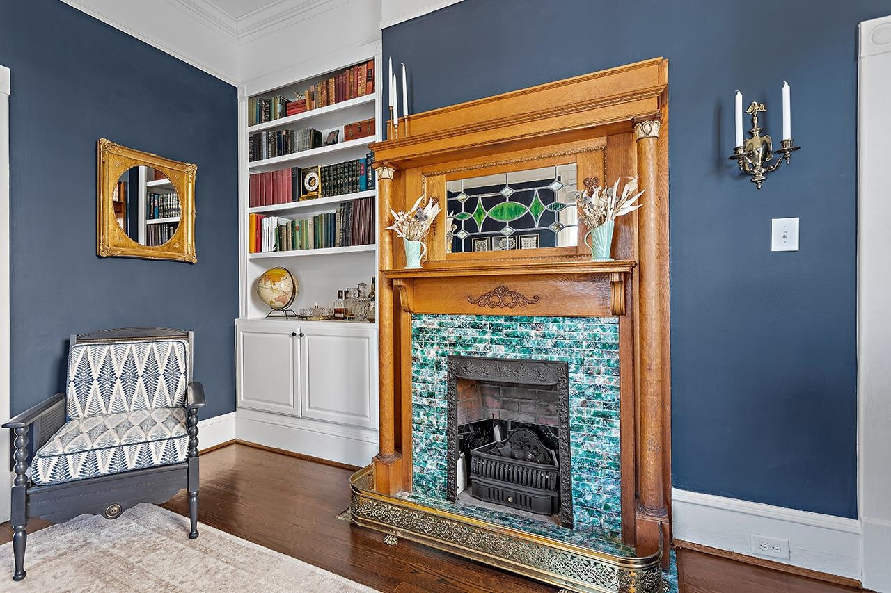 424 East Jones Street Raleigh, NC 27601 - Photo 3 of 27 a living room with furniture and a fireplace