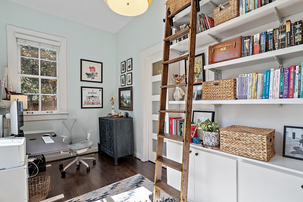 424 East Jones Street Raleigh, NC 27601 - Photo 6 of 27 a view of a workspace with bookshelf