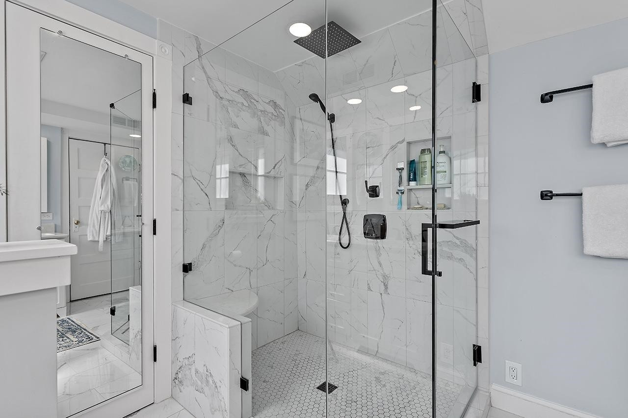 424 East Jones Street Raleigh, NC 27601 - Photo 7 of 27 a bathroom with a shower and a sink