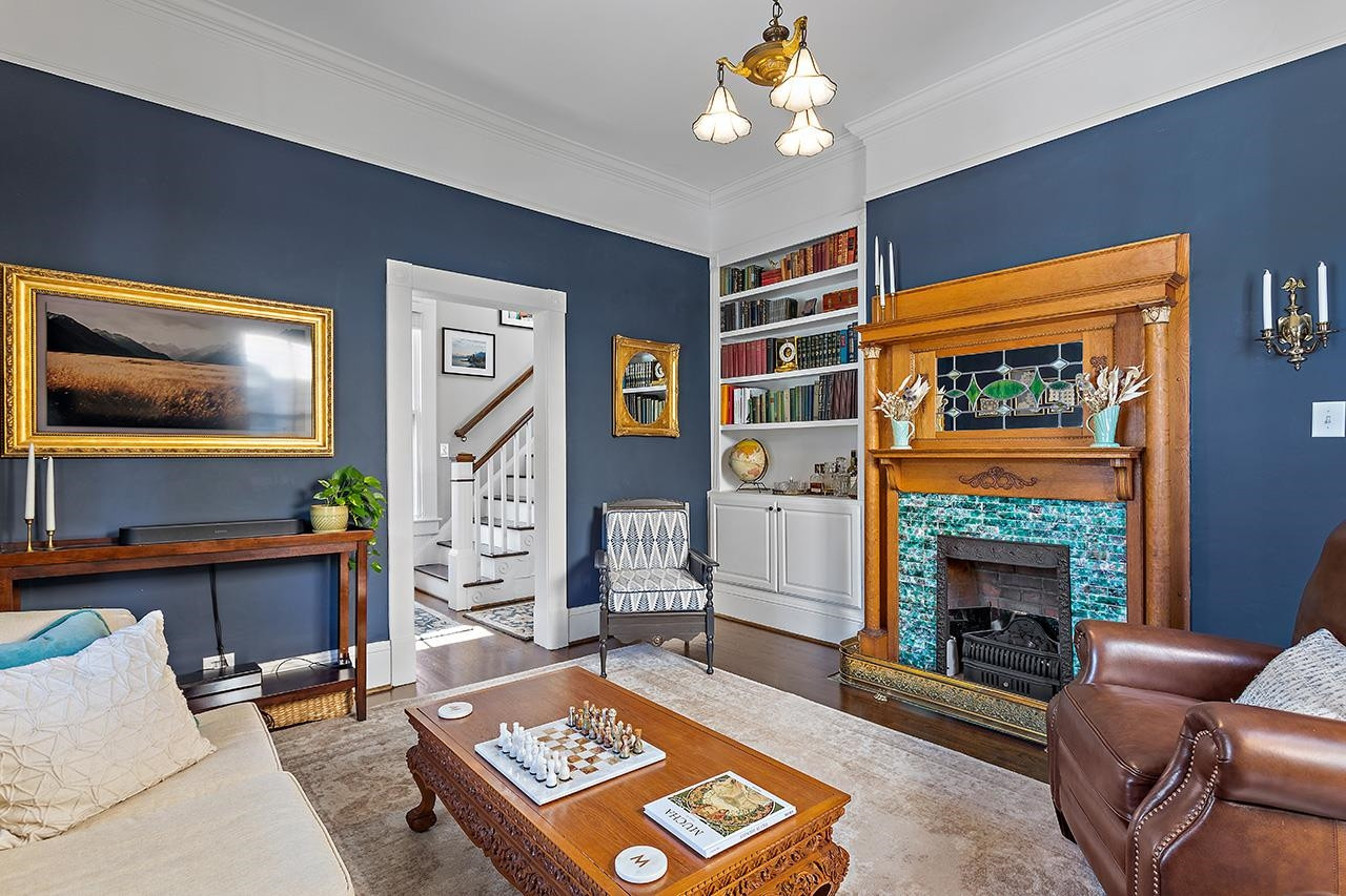 424 East Jones Street Raleigh, NC 27601 - Photo 10 of 27 a living room with furniture and a fireplace
