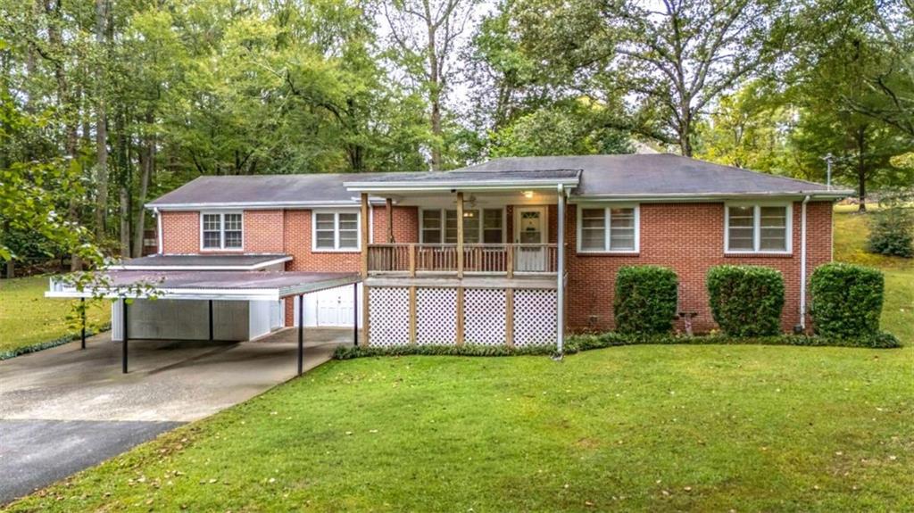 7146 Old Beulah Road Lithia Springs, GA 30122 - Photo 1 of 45 front view of a house with a yard