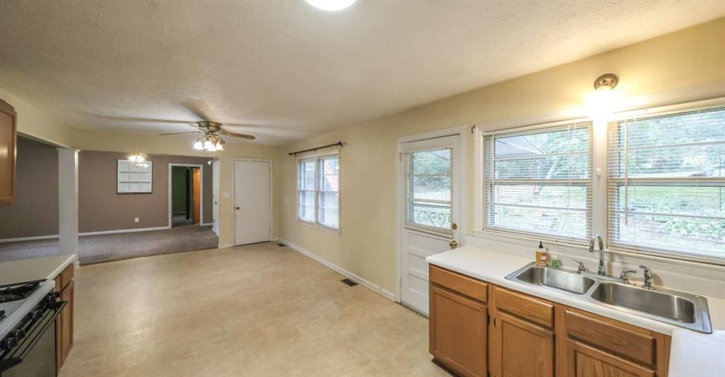 7146 Old Beulah Road Lithia Springs, GA 30122 - Photo 12 of 45 a spacious bathroom with a double vanity sink and a large mirror