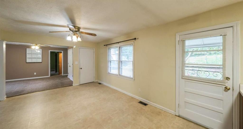 7146 Old Beulah Road Lithia Springs, GA 30122 - Photo 16 of 45 a view of an empty room with a window