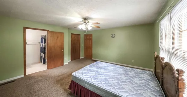 wooden floor in an empty room with a fireplace