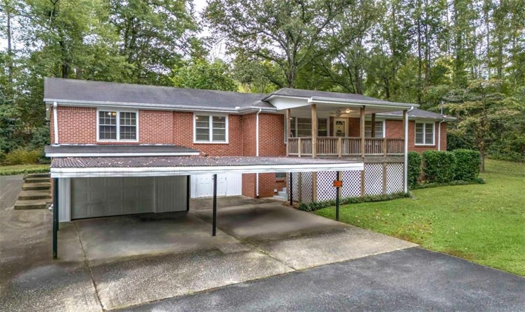 7146 Old Beulah Road Lithia Springs, GA 30122 - Photo 2 of 45 a view of a house with a yard and sitting area