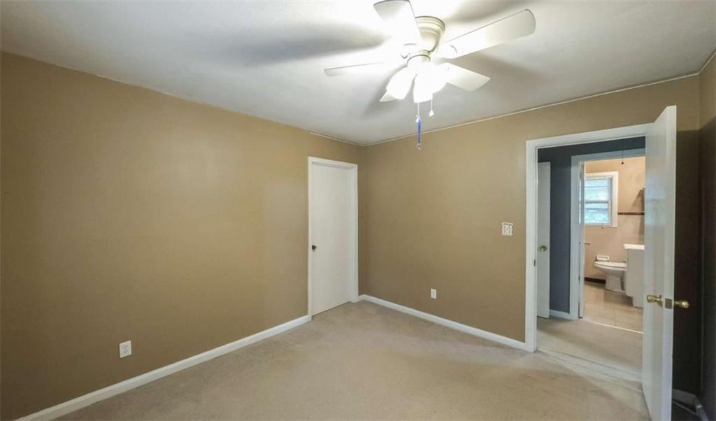 7146 Old Beulah Road Lithia Springs, GA 30122 - Photo 25 of 45 an empty room and a chandelier fan