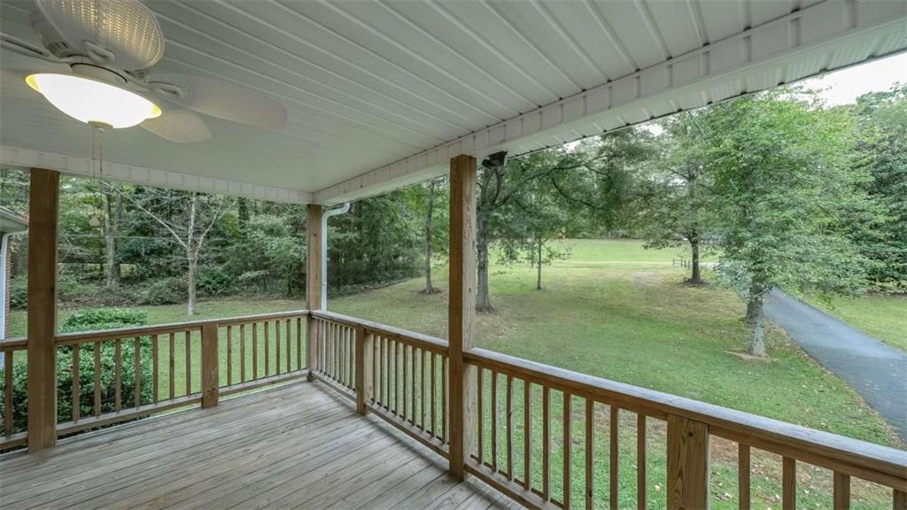 7146 Old Beulah Road Lithia Springs, GA 30122 - Photo 3 of 45 a view of a porch and a yard