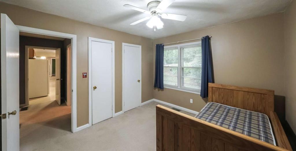 7146 Old Beulah Road Lithia Springs, GA 30122 - Photo 32 of 45 a bedroom with a bed and a window