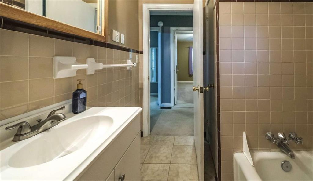 7146 Old Beulah Road Lithia Springs, GA 30122 - Photo 34 of 45 a bathroom with a sink and a tub